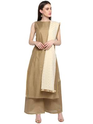 Flaunt Your Rich And Elegant Taste Wearing This Designer Readymade Suit In Beige Color Paired With Off-White Colored Dupatta. This Suit Is Chanderi Based Paired With Georgette Dupatta. This Rich Fabric And Elegant Color Pallet Will Earn You Lots Of Compliments From Onlookers. 