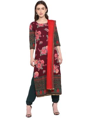 Add This Designer Readymade Suit To Your Wardrobe In Maroon Colored Top Paired With Dark Green Colored Bottom and Red Colored Dupatta. This Suit Is Crepe Based Paired With Net Fabricated Dupatta. 