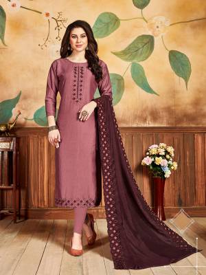Here Is A Designer Embroidered Dress Material In Onion Pink Color Paired With Wine Colored Dupatta. Its Top Is Soft Silk Based Paired With Santoon Bottom And Cotton Silk Fabricated Embroidered Dupatta. Its Fabrics Are Soft Towards Skin And Easy To Carry All Day Long. 