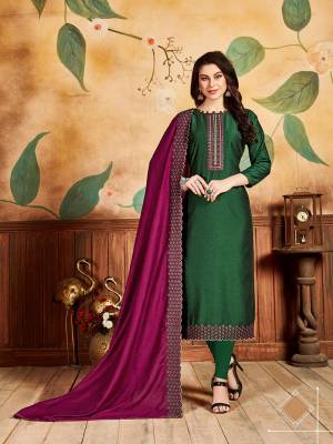 Celebrate This Festive Season With Beauty And Comfort By Getting This Dress Material Stitched As Per Your Desired Fit And Comfort. Its Top And bottom Are In Dark Green Color Paired With Contrasting Magenta Pink Colored Dupatta. Its Top Is Fabricated On Pandora Silk Paired With Santoon Bottom And Cotton Silk Dupatta. 