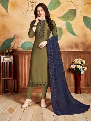 Here Is A Designer Embroidered Dress Material In Olive Green Color Paired With Navy Blue Colored Dupatta. Its Top Is Soft Silk Based Paired With Santoon Bottom And Cotton Silk Fabricated Embroidered Dupatta. Its Fabrics Are Soft Towards Skin And Easy To Carry All Day Long. 