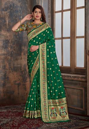 For A Proper Traditional Look, Grab This Designer Silk Based Saree In Green Color Paired With Green Colored Blouse. This Saree And Blouse Are Fabricated On Banarasi Silk Which Also Gives A Rich Look To Your Personality. 
