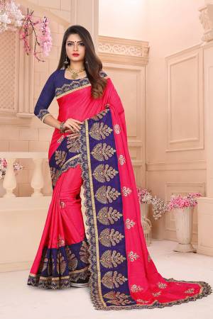 Add This Designer Embroidered Saree In Rani Pink Color Paired With Contrasting Navy Blue Colored Blouse. This Saree And Blouse Are Art Silk Based Beautified With Heavy Embroidery. 