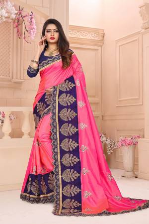 Celebrate This Festive Season With Beauty And Comfort Wearing This Designer Saree In Pink Color Paired With Contrasting Navy Blue Colored Blouse. This Saree And Blouse Are Silk Based Which Gives A Rich Look To Your Personality. 