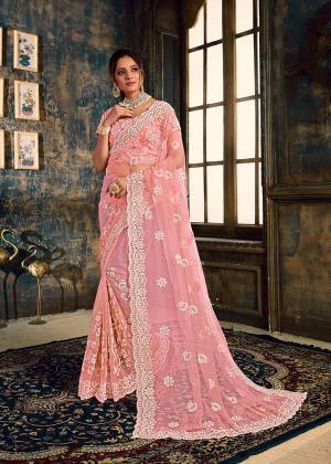 Look Pretty Wearing This Heavy Designer Saree In Pink Color Paired With Pink Colored Blouse. This Saree And Blouse Are Fabricated On Net Beautified With Heavy Attractive Embroidery All Over. Buy Now.
