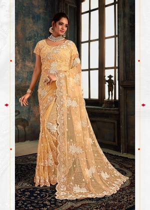 Look Pretty Wearing This Heavy Designer Saree In Light Yellow Color Paired With Light Yellow Colored Blouse. This Saree And Blouse Are Fabricated On Net Beautified With Heavy Attractive Embroidery All Over. Buy Now.