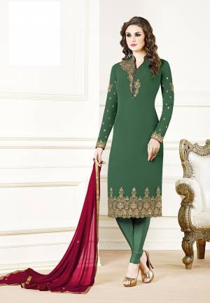Grab This Beautiful Designer Straight Suit In Dark Green Color Paired With Dark Pink Colored Dupatta. Its Top Is Fabricated On Georgette Paired With Santoon Bottom And Chiffon Dupatta. Its Fabric Is Light In Weight And Easy To Carry All Day Long. 