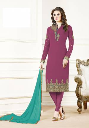Grab This Beautiful Designer Straight Suit In Magenta Pink Color Paired With Blue Colored Dupatta. Its Top Is Fabricated On Georgette Paired With Santoon Bottom And Chiffon Dupatta. Its Fabric Is Light In Weight And Easy To Carry All Day Long. 