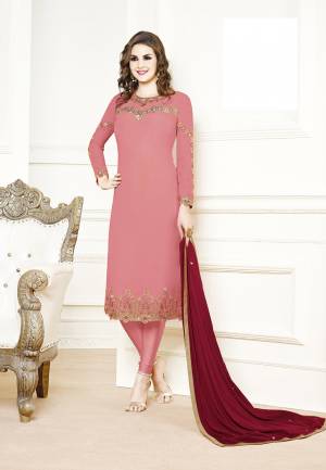 Get Ready For The Upcoming Festive And Wedding Season Wearing This Designer Straight Suit In Pink Color Paired With Contrasting Red Colored Dupatta. Its Top Is Georgette Based Paired With Santoon Bottom And Chiffon Fabricated Dupatta. Buy Now.
