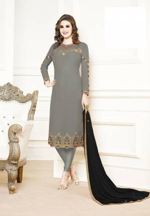 Get Ready For The Upcoming Festive And Wedding Season Wearing This Designer Straight Suit In Grey Color Paired With Contrasting Black Colored Dupatta. Its Top Is Georgette Based Paired With Santoon Bottom And Chiffon Fabricated Dupatta. Buy Now.