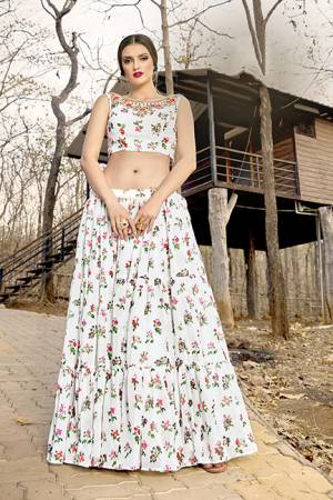 Here Is A Pretty Pair Of Crop Top And Skirt In White Color. This Pretty Printed Crop Top And Skirt Are Georgette Based Which Is Light In Weight And Easy To Carry All Day Long. 