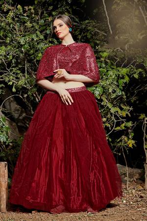 Catch All The Limelight At The Next Function You Attend Wearing This Designer Readymade Pair Of Crop Top And Skirt In Maroon Color. This Top Is Imported Fabric Based Paired With Net Fabricated Skirt. 
