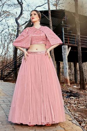 Catch All The Limelight At The Next Function You Attend Wearing This Designer Readymade Pair Of Crop Top And Skirt In Baby Pink Color. This Top Is Imported Fabric Based Paired With Net Fabricated Skirt. 