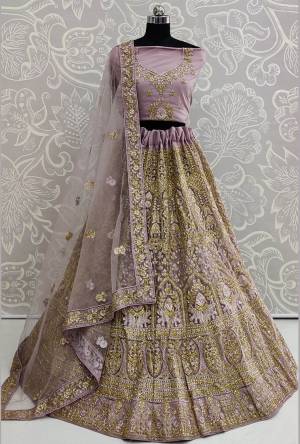 This Wedding Season Be The Most Trendiest Diva Wearing This Heavy Designer Lehenga Choli In Purple Color. Its Pretty And Detailed Heavy Embroidered Blouse, Lehenga And Dupatta Are Fabricated On Net. Its Pretty Color And Detailed Embroidery Will Earn You Lots Of Compliments From Onlookers. 