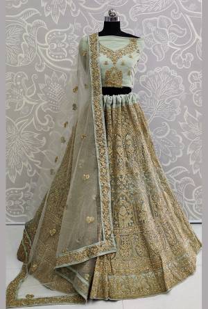 This Wedding Season Be The Most Trendiest Diva Wearing This Heavy Designer Lehenga Choli In Pastel Green Color. Its Pretty And Detailed Heavy Embroidered Blouse, Lehenga And Dupatta Are Fabricated On Net. Its Pretty Color And Detailed Embroidery Will Earn You Lots Of Compliments From Onlookers. 