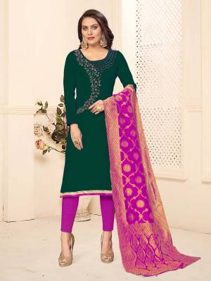 If Those Readymade Suit Does Not Lend You The Desired Comfort, Than Grab This Dress Material In Dark Green And Rani Pink Color And Get This Stitched As Per Your Desired Fit And Comfort. Its Top And Bottom are Cotton Based Paired With Banarasi Silk Dupatta. 