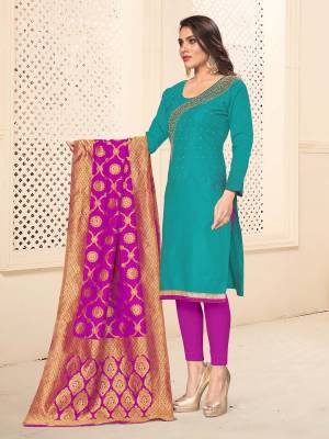 For Your Semi-Casual Wear, Grab This Designer Embroidered Dress Material In Turquoise Blue Colored Top Paired With Contrasting Rani Pink Colored Bottom And Dupatta. This Dress Material Is Cotton Based Paired With Banarasi Silk Fabricated Dupatta. 