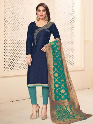 If Those Readymade Suit Does Not Lend You The Desired Comfort, Than Grab This Dress Material In Navy Blue And Turquoise Blue Color And Get This Stitched As Per Your Desired Fit And Comfort. Its Top And Bottom are Cotton Based Paired With Banarasi Silk Dupatta. 
