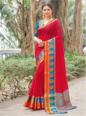 Adorn The Pretty Angelic Look Wearing This Pretty Attractive Saree In Red Color Paired With Contrasting Blue Colored Blouse. This Saree And Blouse Are Fabricated On Handloom Silk Which Gives A Rich Look To Your Personality. Buy Now.