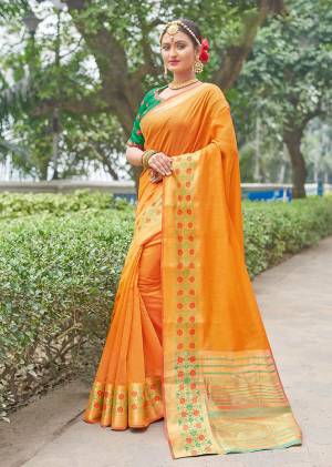 Celebrate This Festive Season In A Proper Traditional Look Wearing This Lovely Saree In Orange Color Paired With Contrasting Green Colored Blouse. This Saree And Blouse Are Fabricated On Handloom Silk Beautified With Weave And Embroidered Blouse. Buy Now.