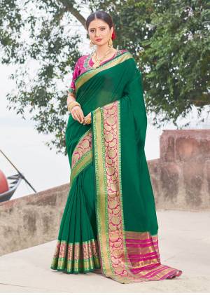 Shine Bright In This Pretty Designer Silk Based Saree In Dark Green Color Paired With Contrasting Dark Pink Colored Blouse. This Saree And blouse Are Fabricated On Handloom Silk Beautified With Weave And Embroidery. Buy This Lovely Saree Now.