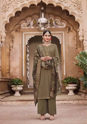 Here Is A Very Beautiful Royal looking Designer Straight Suit In Olive Green Color. Its Top Is Crepe Based Beeautified With Embroidery Paired With Soft Silk Bottom And Jacquard Silk Fabricated Dupatta. It IS Suitable For Festive And Wedding Function Wear. 