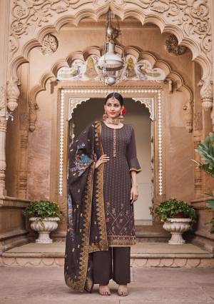 You Will Definitely Earn Lots Of Compliments Wearing This Designer Rich Suit In Dark Wine Color. Its Pretty Embroidered Top Is Crepe Based Paired With Soft Silk Bottom And Jacquard Silk Fabricated Dupatta. Buy This Lovely Suit Now.