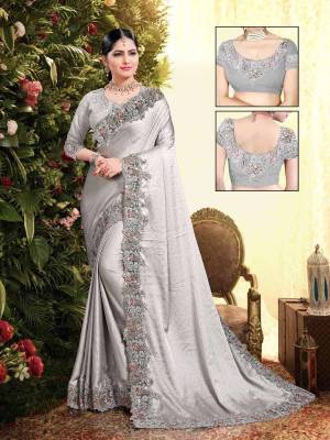 Flaunt Your Rich and Elegant Taste Wearing This Designer Saree In Light Grey Color. This Saree Is Fabricated On Satin Georgette Paired With Art Silk Fabricated Blouse. It Is Beautified With Elegant Heavy Embroidered Lace Border. Buy Now.