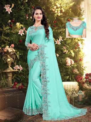 Flaunt Your Rich and Elegant Taste Wearing This Designer Saree In Sea Green Color. This Saree Is Fabricated On Satin Georgette Paired With Art Silk Fabricated Blouse. It Is Beautified With Elegant Heavy Embroidered Lace Border. Buy Now.