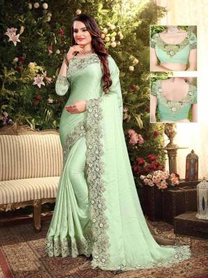 Flaunt Your Rich and Elegant Taste Wearing This Designer Saree In Pastel Green Color. This Saree Is Fabricated On Satin Georgette Paired With Art Silk Fabricated Blouse. It Is Beautified With Elegant Heavy Embroidered Lace Border. Buy Now.