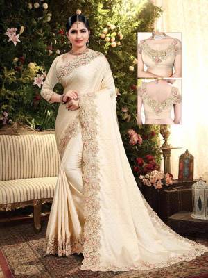 Flaunt Your Rich and Elegant Taste Wearing This Designer Saree In Cream Color. This Saree Is Fabricated On Satin Georgette Paired With Art Silk Fabricated Blouse. It Is Beautified With Elegant Heavy Embroidered Lace Border. Buy Now.