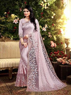 Flaunt Your Rich and Elegant Taste Wearing This Designer Saree In Lilac Color. This Saree Is Fabricated On Satin Georgette Paired With Art Silk Fabricated Blouse. It Is Beautified With Elegant Heavy Embroidered Lace Border. Buy Now.