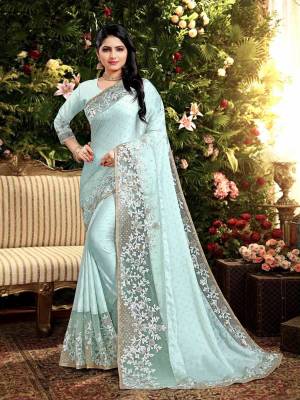 Flaunt Your Rich and Elegant Taste Wearing This Designer Saree In Aqua Blue Color. This Saree Is Fabricated On Satin Georgette Paired With Art Silk Fabricated Blouse. It Is Beautified With Elegant Heavy Embroidered Lace Border. Buy Now.