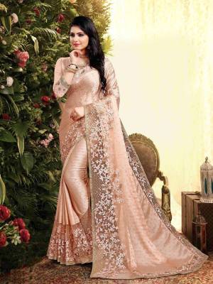 Flaunt Your Rich and Elegant Taste Wearing This Designer Saree In Beige. This Saree Is Fabricated On Satin Georgette Paired With Art Silk Fabricated Blouse. It Is Beautified With Elegant Heavy Embroidered Lace Border. Buy Now.