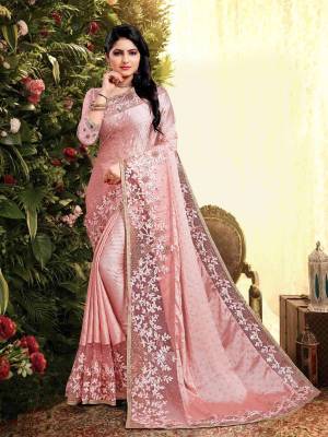 Flaunt Your Rich and Elegant Taste Wearing This Designer Saree In Light Pink Color. This Saree Is Fabricated On Satin Georgette Paired With Art Silk Fabricated Blouse. It Is Beautified With Elegant Heavy Embroidered Lace Border. Buy Now.