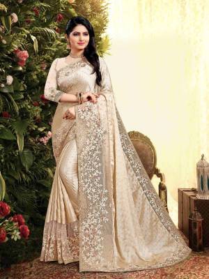 Flaunt Your Rich and Elegant Taste Wearing This Designer Saree In Cream Color. This Saree Is Fabricated On Satin Georgette Paired With Art Silk Fabricated Blouse. It Is Beautified With Elegant Heavy Embroidered Lace Border. Buy Now.