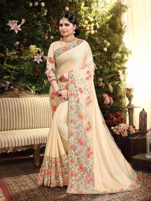 Here Is A Pretty Heavy Designer Saree In Rich Cream Color. This Saree Is Is Butter Silk Based Paired With Art Silk Fabricated Blouse. It Has Attractive Broad Embroidered Lace Border With Contrasting Work. 