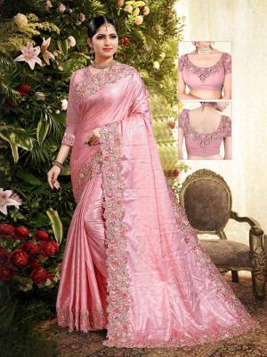Add This Lovely Saree To Your Wardrobe In Pink Color Paired With Pink Colored Blouse. This Saree Is Fabricated On Fancy Silk Paired With Art Silk Fabricated Blouse. Its Pretty Color Pallete And Designer Look Will Earn You Lots Of Compliments From Onlookers. 
