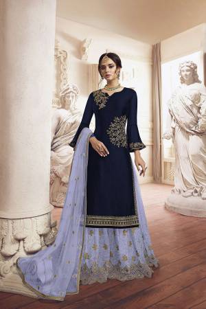 Grab This Very Beautiful Designer Sharara Suit In Navy Blue Colored Top Paired With Grey Colored Bottom And Dupatta. Its Top Is Fabricated On Georgette Paired With Net Fabricated Bottom and Dupatta. It Has Detailed Pretty Embroidery Giving An Attractive Look. 