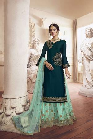 Grab This Very Beautiful Designer Sharara Suit In Teal Green Colored Top Paired With Sea Green Colored Bottom And Dupatta. Its Top Is Fabricated On Georgette Paired With Net Fabricated Bottom and Dupatta. It Has Detailed Pretty Embroidery Giving An Attractive Look. 