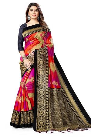 Celebrate This Festive Season With Beauty And Comfort Wearing This Designer Silk Based Saree In Pink And Red Color Paired With Black Colored Blouse. This Pretty Saree And Blouse Are Fabricated On Art Silk Beautified With Heavy Weaved Lace Border. Buy Now.
