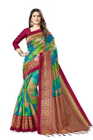 For A Royal Look, Grab This Designer Silk based Saree In Green And Blue Color Paired With Magenta Pink Colored Blouse. This Saree And Blouse Are Fabricated On Art Silk Beautified With Weaved Lace Border. Buy This Pretty Elegant Saree Now
