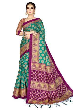 For A Royal Look, Grab This Designer Silk based Saree In Sea Green Color Paired With Magenta Pink Colored Blouse. This Saree And Blouse Are Fabricated On Art Silk Beautified With Weaved Lace Border. Buy This Pretty Elegant Saree Now