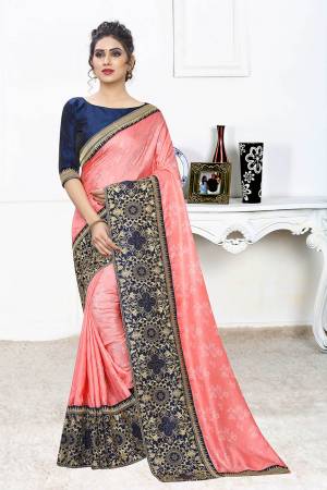 Celebrate This Festive Season With This Designer Elegant Saree In Peach Color Paired With Contrasting Navy Blue Colored Blouse. This Saree Is Fabricated On Jacquard Silk Paired With Art Silk Fabricated Blouse. Its Broad Border Is Beautified With Heavy Jari & Stone Work. 