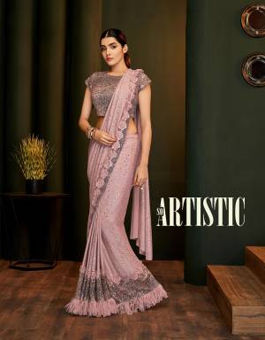 Embrace the artistic look in this shimmery and pretty pink ready-to wear saree and flaunt your rich tastes