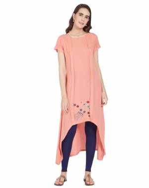 Grab This Pretty High Low Patterned Designer Readymade Kurti In Peach Color Fabricated On Linen Beautified With Pretty Thread Work. 