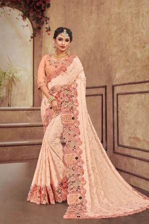 Get Ready For The Upcoming Wedding Season With This Heavy Designer Saree With Heavy Embroidery Fabricated On Satin Georgette. Its Attractive Embroidery And Pretty Color Will Definitely Earn You Lots Of Compliments From Onlookers. 
