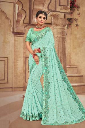 Get Ready For The Upcoming Wedding Season With This Heavy Designer Saree With Heavy Embroidery Fabricated On Satin Silk. Its Attractive Embroidery And Pretty Color Will Definitely Earn You Lots Of Compliments From Onlookers. 