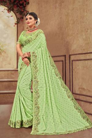 You Will Definitely Earn Lots Of Compliments Wearing This Heavy Designer Which Is Perfectly Suitable For Wedding Wear. This Pretty Saree Is Satin Silk Based Which Is Durable And Eary To Carry.