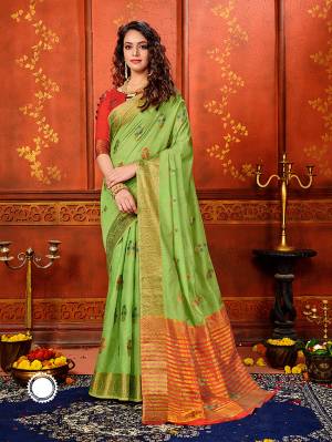 Adorn A Rich Look Wearing This Designer Saree In Green Color Paired With Contrasting Red Colored Blouse. This Saree and Blouse Are Fabricated On Art Silk Beautified With Attractive Weave. Buy Now.